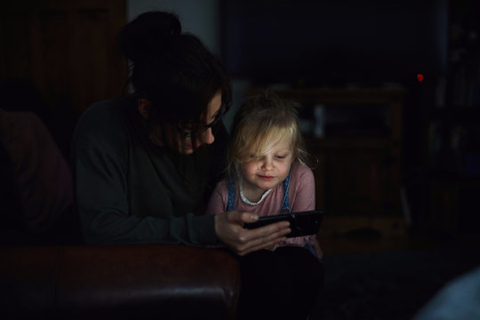 Woman and child using a smart phone