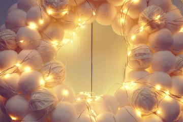 Christmas, New Year's white wreath. round wreath of white soft pompons and shining garland .White...