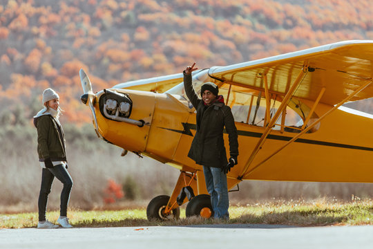 Friends gathered on airfield, taking turns flying gliders in upstate New York