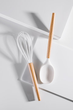 Kitchen utensils on white.
