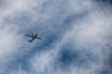 Fototapeta na wymiar the plane is flying among the clouds