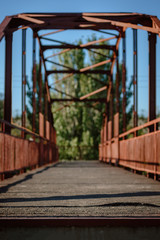 Old metal construction of empty pedestrian bridge in city