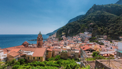 Fototapeta premium Houses of the town of Amalfi, Italy, by mountains and sea