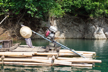 The Wooden floating raft with motor