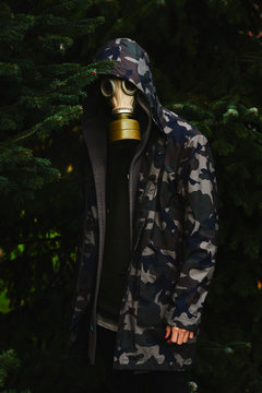 Man with gasmask in woods