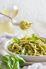 Spaghetti pasta with pesto sauce