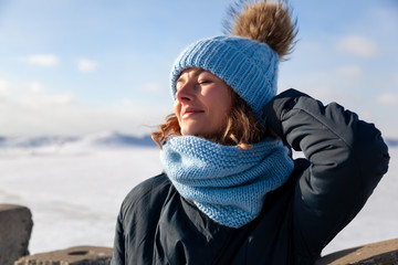Portrait beauty woman model on winter background. Beautiful modern  young woman wearing blue...