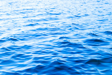 View of a Crystal clear sea water texture. View from above Natural blue background. Turquoise ripple water reflection in tropical beach. Blue ocean wave. Summer sea. Top view