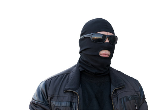 the criminal in the black balaclava and glasses on an isolated background