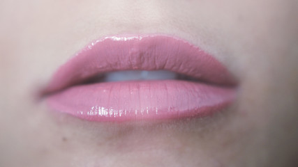 Close up beautiful sensual pink lips of young girl