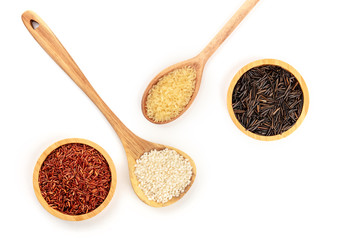 A photo of various types of rice, shot from the top on a white background with copy space