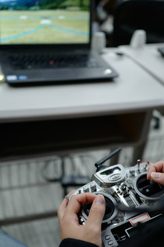 man Practice drone on a computer