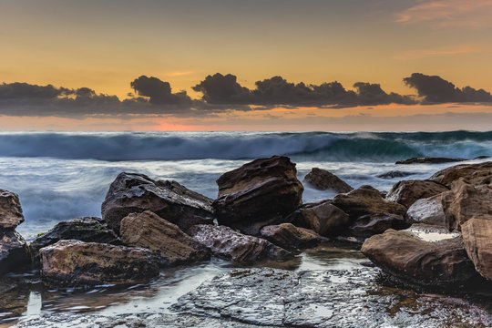 Waves and Rocks at Sunrise