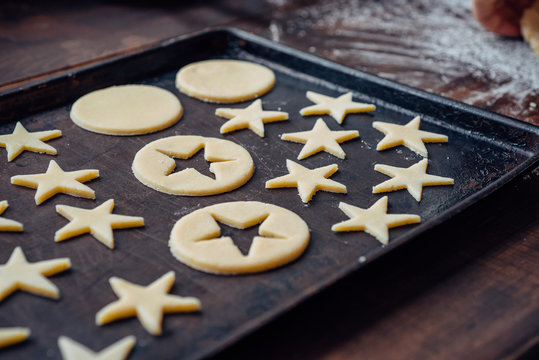 Christmas star shaped shortbread cookie dough in baking sheet