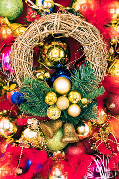 Vertical image of christmas wreath and decorations.