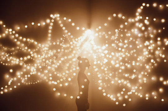 Silhouette of a woman in lights