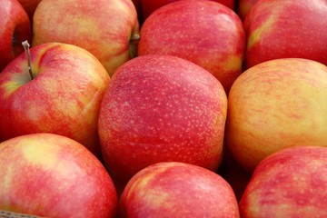 Red ripe apples on the counter market
