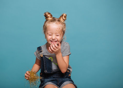 Cute young girl having fun with party accessories