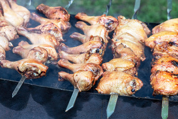 Appetizing shashlik from chicken meat on metal skewers