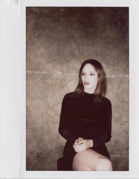 young androgyne man in small black dress
