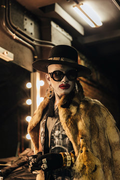 Fashion elegant bizarre man with extreme makeup