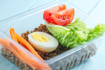 Healthy, healthy food in a plastic container. Snack at lunchtime. Diet, proper, healthy food