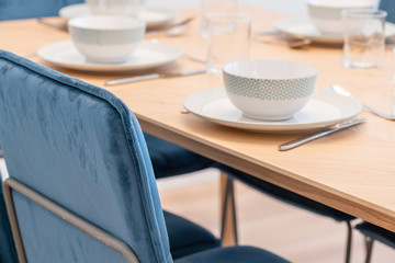 Clean white tableware on a table