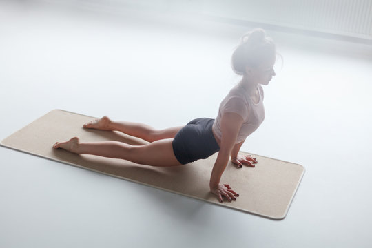 Woman In Upward Facing Dog Pose