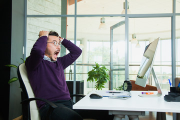 Excited embarraced businessman scream at office in horror
