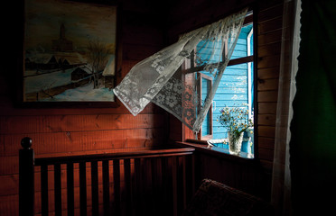 Fototapeta premium wind develops a curtain in a window