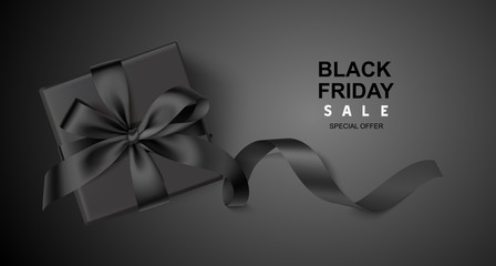 Decorative black gift box with long ribbon on black background. Black friday sale design template. Vector illustration