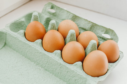 Eggs on green container