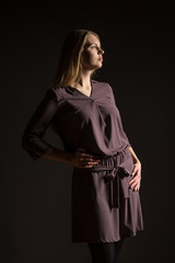 Caucasian white female model portrait. Beautiful girl, long blonde hair. Woman posing studio shot...