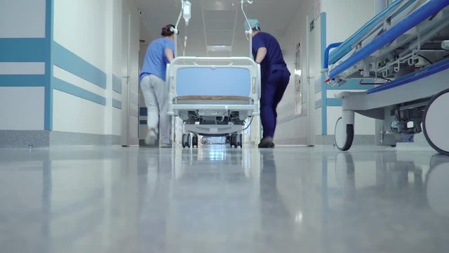 Patient Transportation in Hospital's Hallway on Surgical Bed