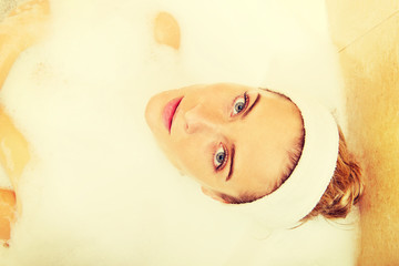 Young woman relaxing in bath