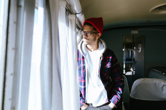 Portrait Of A Latin Man Traveling Alone By Train.