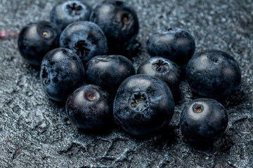 blueberries on dark concrete background