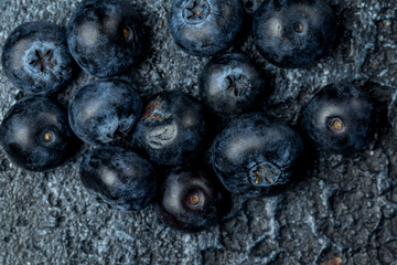 blueberries on dark concrete background