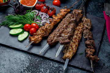 platter of different kebabs