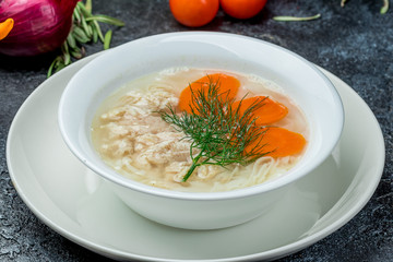 Chicken soup bouillon in a plate