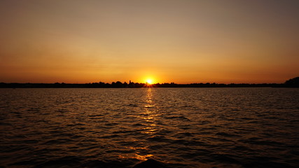 Naklejka premium sunset on the river