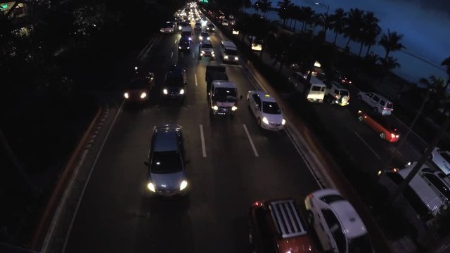 Roxas Blvd., Manila, Philippines - September 23, 2016: Rush hour night traffic of vehicles passing six lane road. aerial