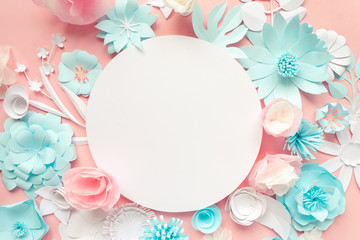blue, pink and white paper flowers on the pink background