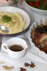 Gravy and mashed potato on a holiday table. Selective focus.