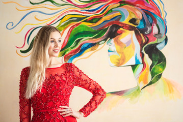 Obraz na płótnie Canvas beautiful young girl in red dress
