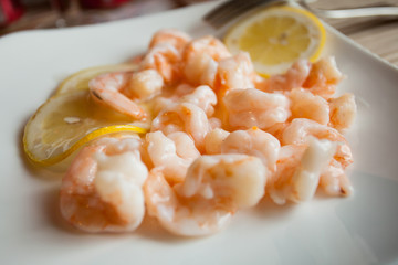 Shrimps with lemon in chinese restaurant.