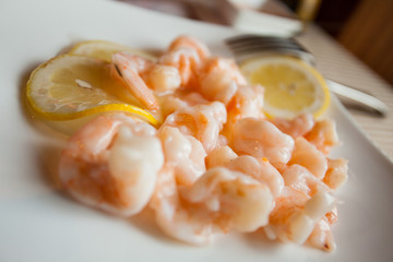 Shrimps with lemon in chinese restaurant.