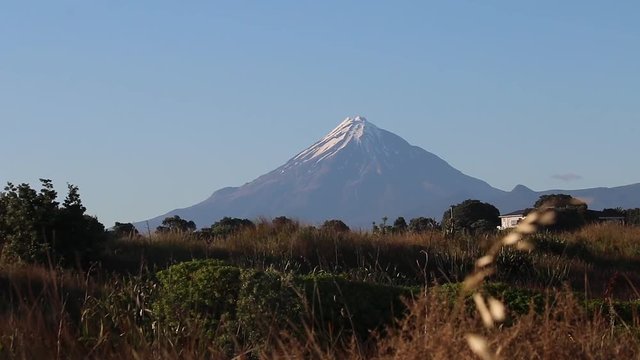Mount Taranaki Egmont volcano sun clear sky new zealand focus pull