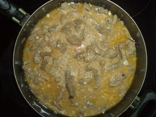 stew with sauce in a saucepan