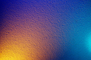 Yellow light on blue relief background